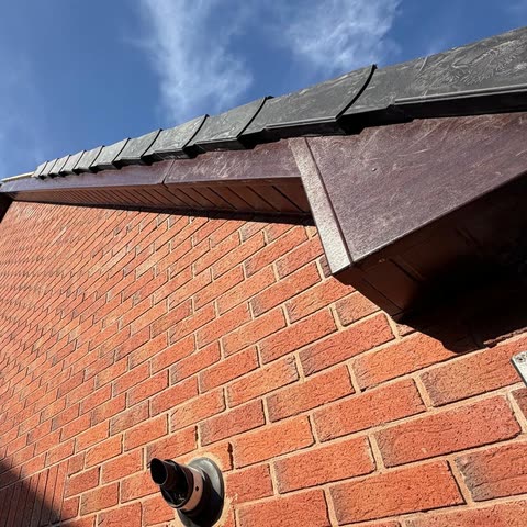 Close-up of a new fascia, soffit and dry verge on a brick gable